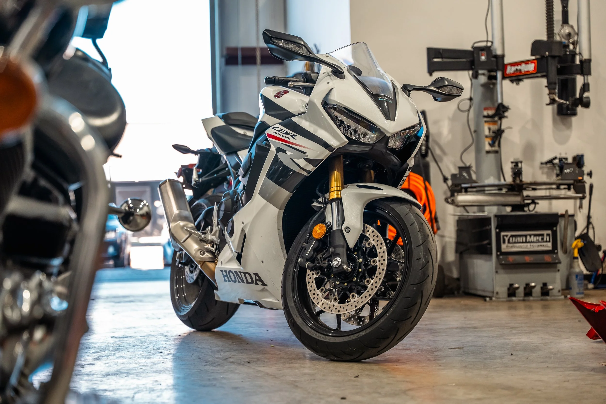Honda motorcycle inside the MotorGeek workshop